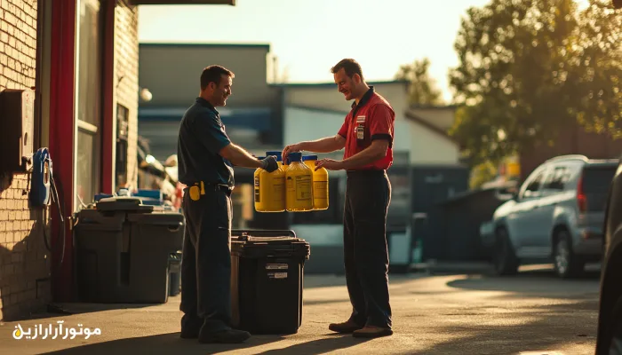 تحویل چند بطری روغن موتور زرد بین دو تعمیرکار در فضای باز تعمیرگاه